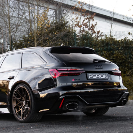 Rear angle shot of the Audi RS6 C8 equipped with the Akrapovič Evolution Line (Titanium), demonstrating seamless integration and premium performance exhaust design.