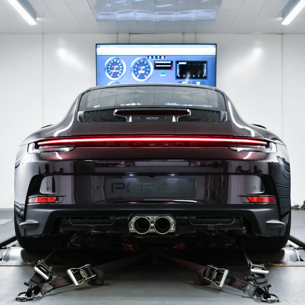 Porsche 911 GT3 Touring (992) strapped on the dyno at PERON Automotive after Akrapovič Slip-On Race Line Titanium Performance Exhaust installation, tailpipes on display during tuning by PERON Tuning.