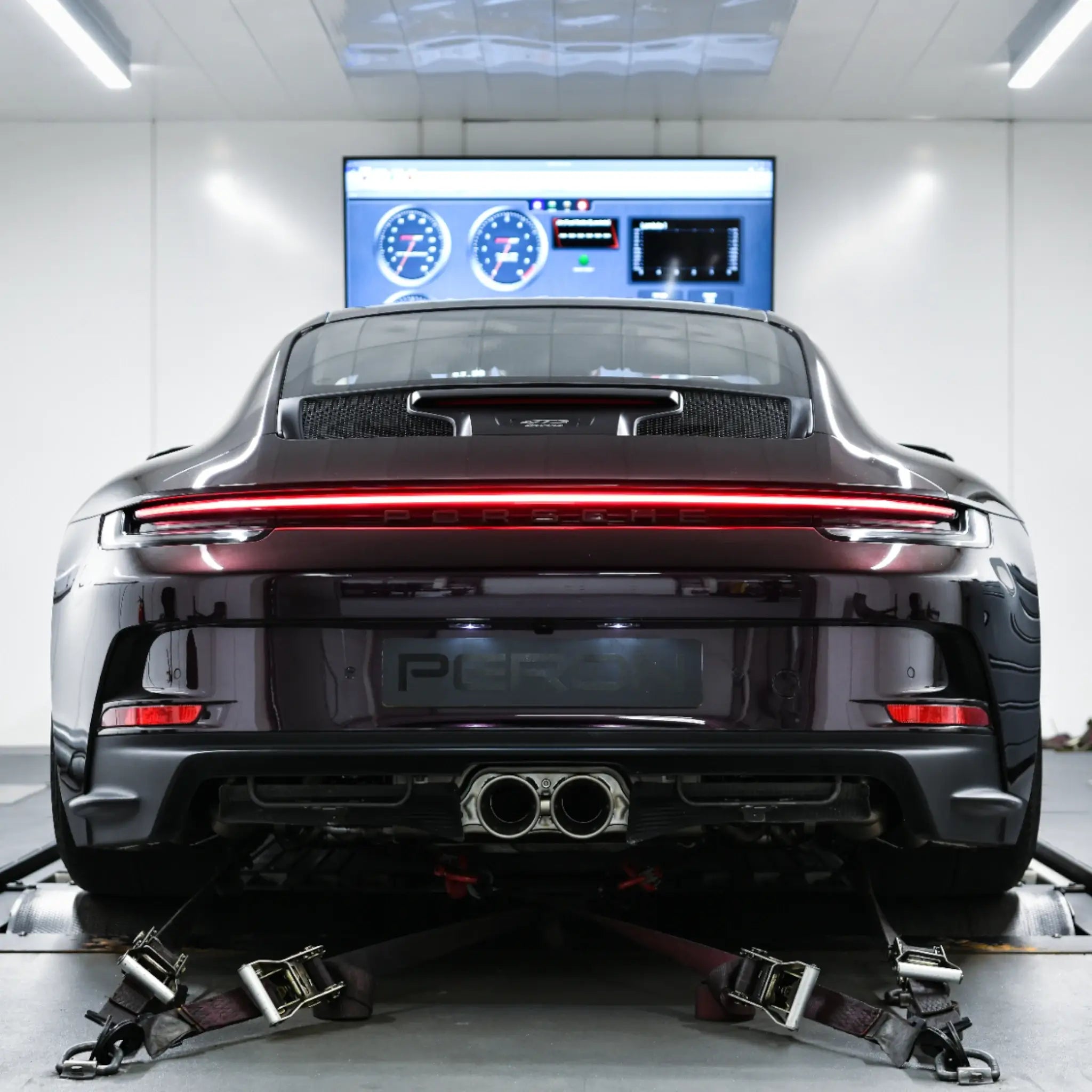 Porsche 911 GT3 Touring (992) strapped on the dyno at PERON Automotive after Akrapovič Slip-On Race Line Titanium Performance Exhaust installation, tailpipes on display during tuning by PERON Tuning.