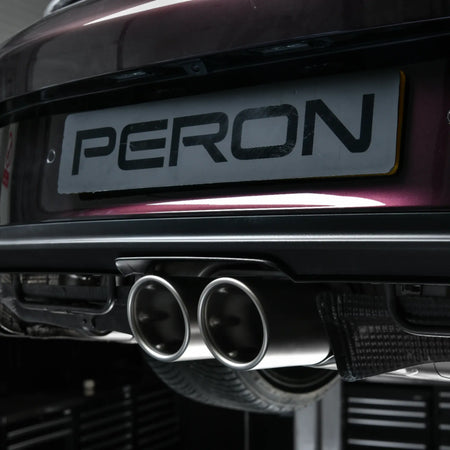 Close-up of Akrapovič twin titanium tailpipes installed on Porsche 911 GT3 Touring (992) at PERON Automotive, showcasing precision-crafted design and premium finish.