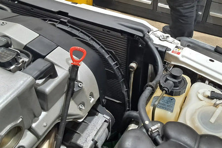 CSF 7240 radiator fitted alongside the factory coolant expansion tank in a Mercedes-Benz R129