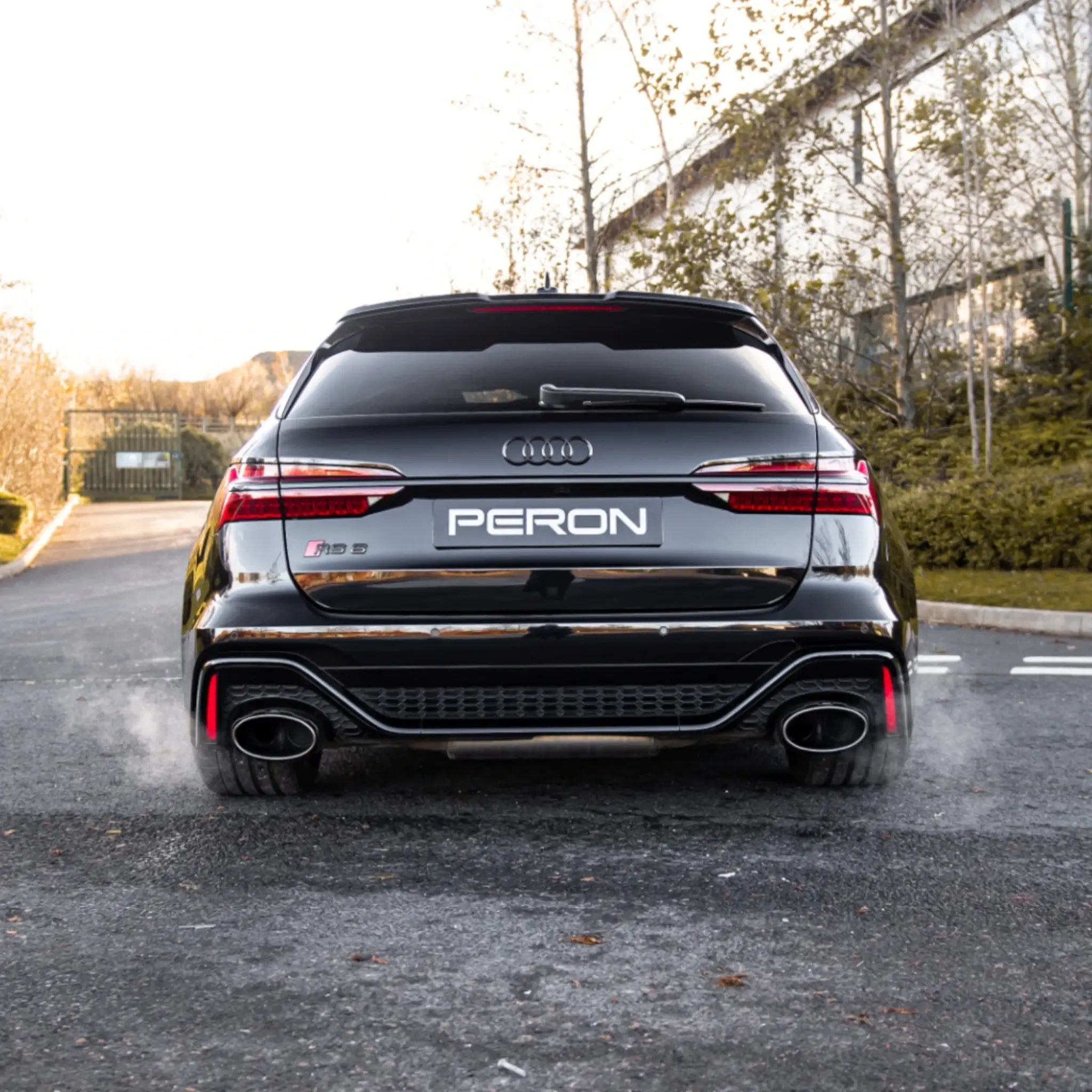Rear shot of the Audi RS6 C8 with the Akrapovič Evolution Line (Titanium) installed, capturing the performance exhaust system and its commanding presence.