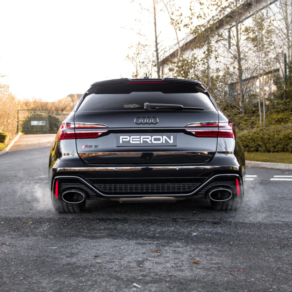 Rear shot of the Audi RS6 C8 with the Akrapovič Evolution Line (Titanium) installed, capturing the performance exhaust system and its commanding presence.