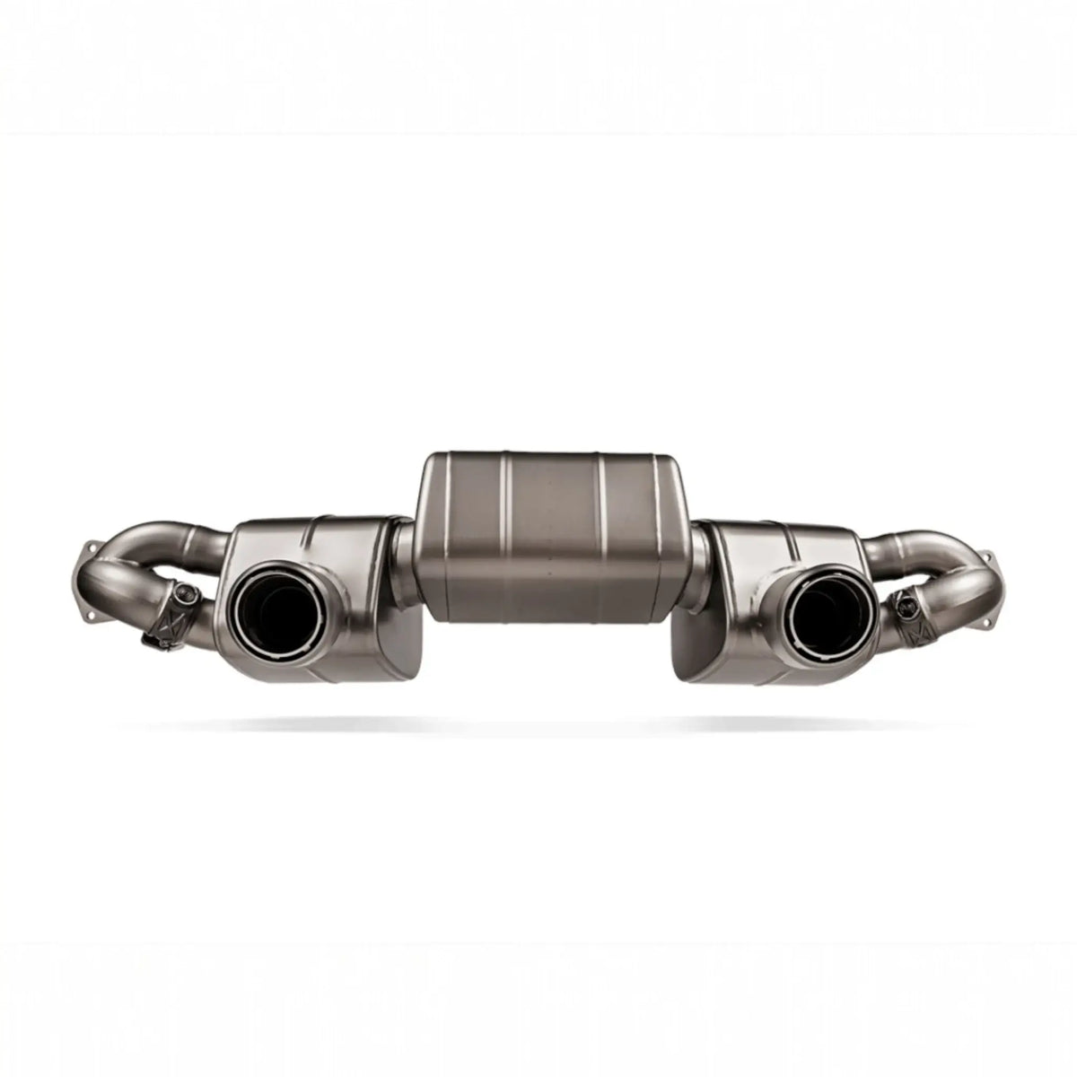 Detailed view of the Akrapovic Slip-On Race Line system for the Porsche 718 Cayman GT4 RS, highlighting titanium craftsmanship.