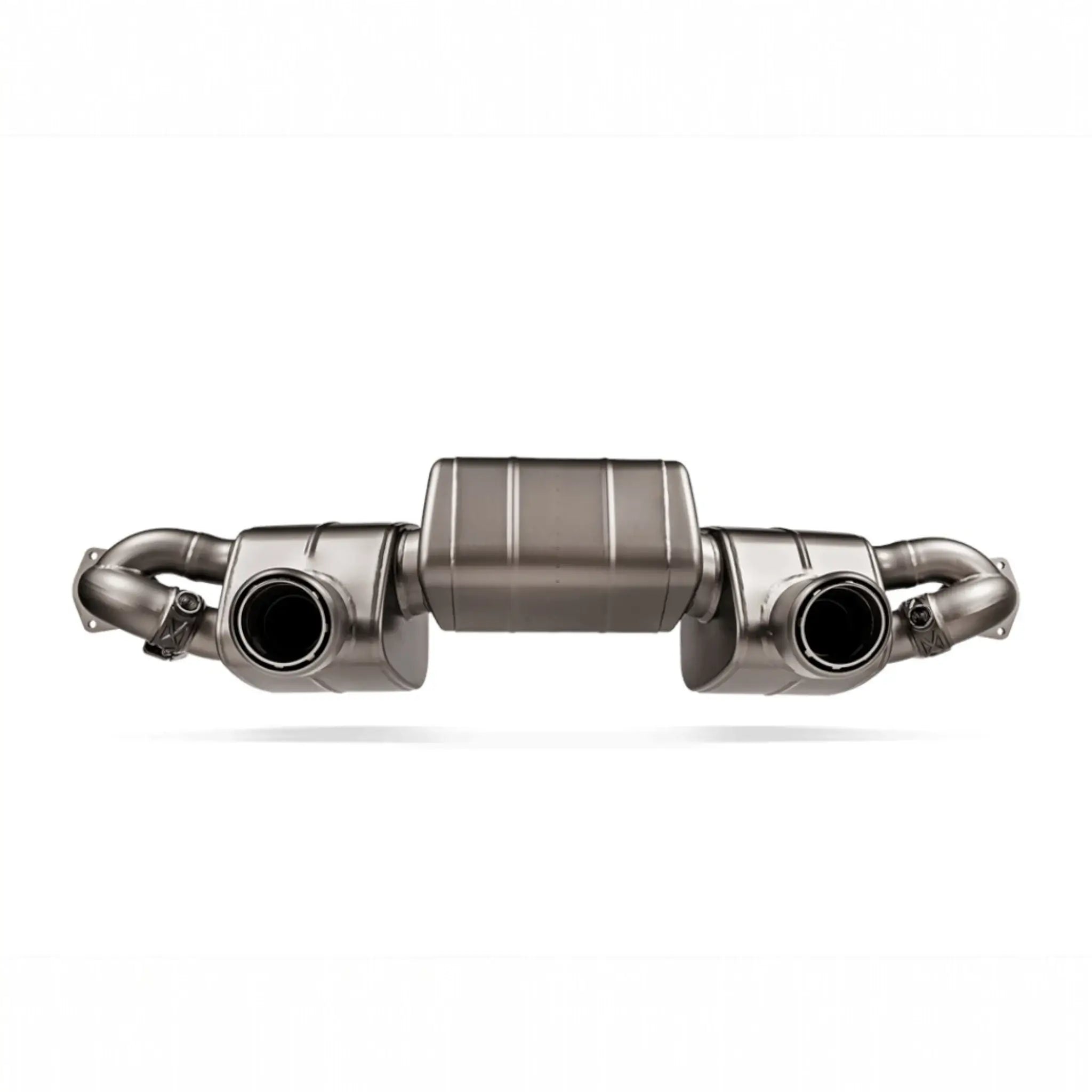 Detailed view of the Akrapovic Slip-On Race Line system for the Porsche 718 Cayman GT4 RS, highlighting titanium craftsmanship.