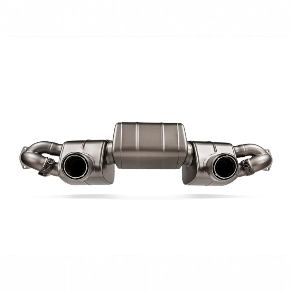 Detailed view of the Akrapovic Slip-On Race Line system for the Porsche 718 Cayman GT4 RS, highlighting titanium craftsmanship.