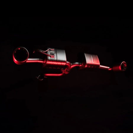Artistic shot of the Akrapovič Slip-On Race Line (Titanium) system for the Toyota GR Yaris (Gen 2), illuminated with red accent lighting to emphasise its advanced design.