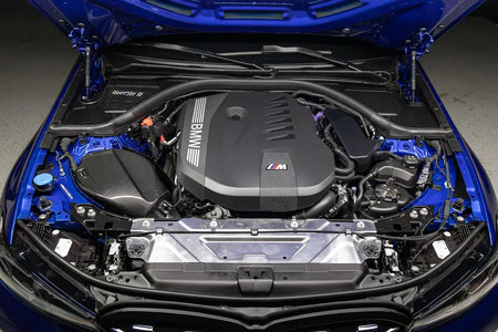 Eventuri B58 Gen 3 carbon intake installed in a blue BMW G2x engine bay