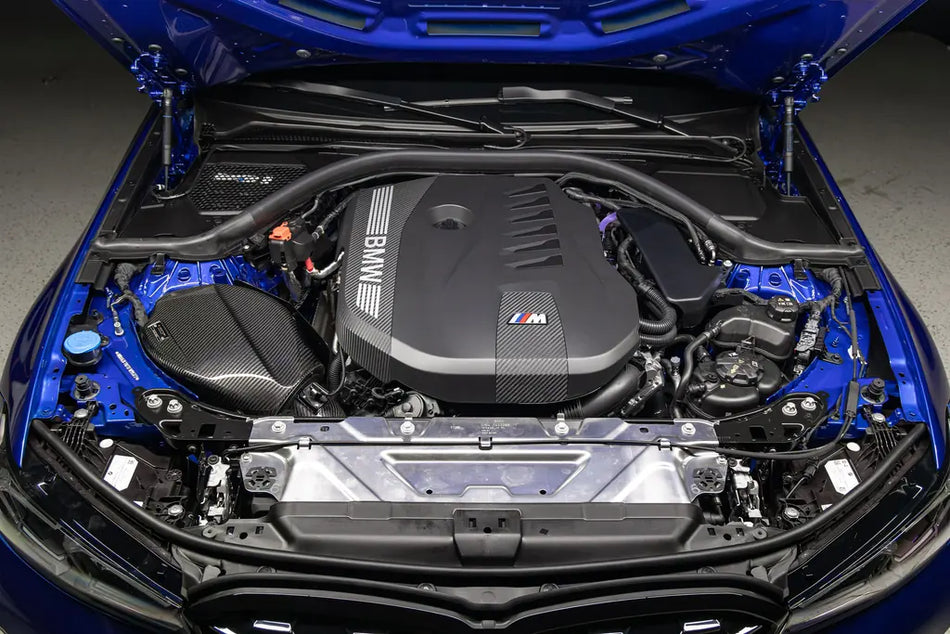 Eventuri B58 Gen 3 carbon intake installed in a blue BMW G2x engine bay
