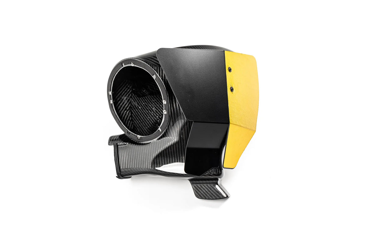 Eventuri carbon airbox showing the filter opening, gold heat shield and wheel-arch air scoop