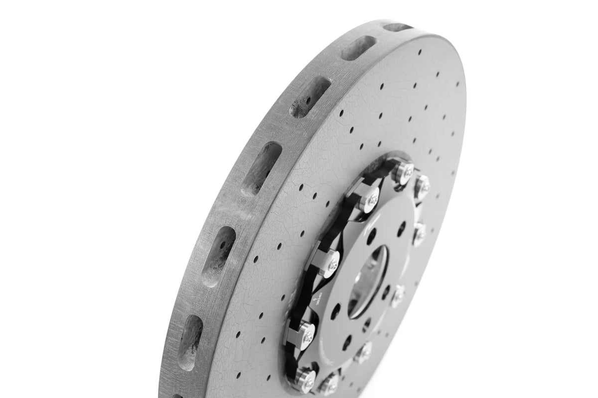 Angled view of a RacingLine drilled carbon ceramic brake disc